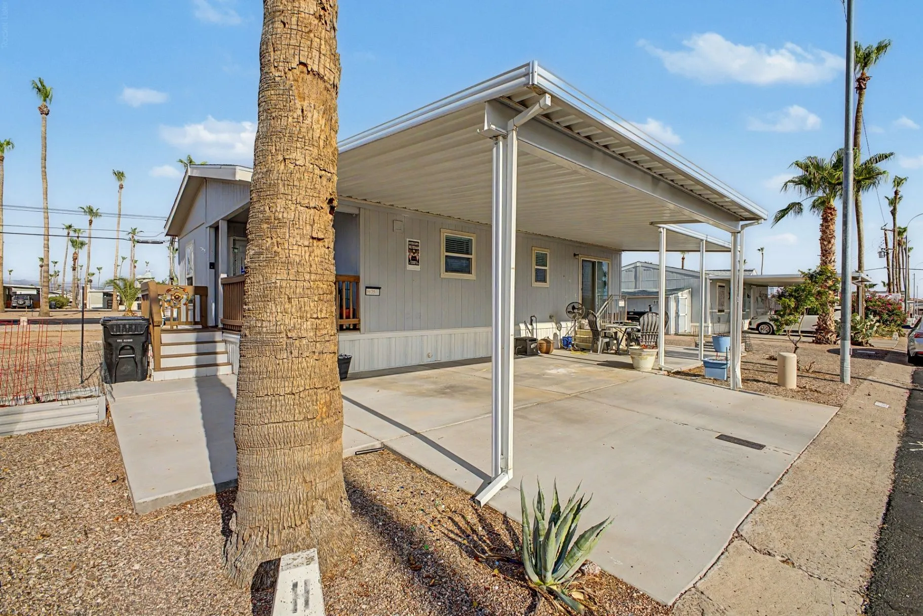Exterior and covered parking perspective of 7807 E Main St, Unit H-25